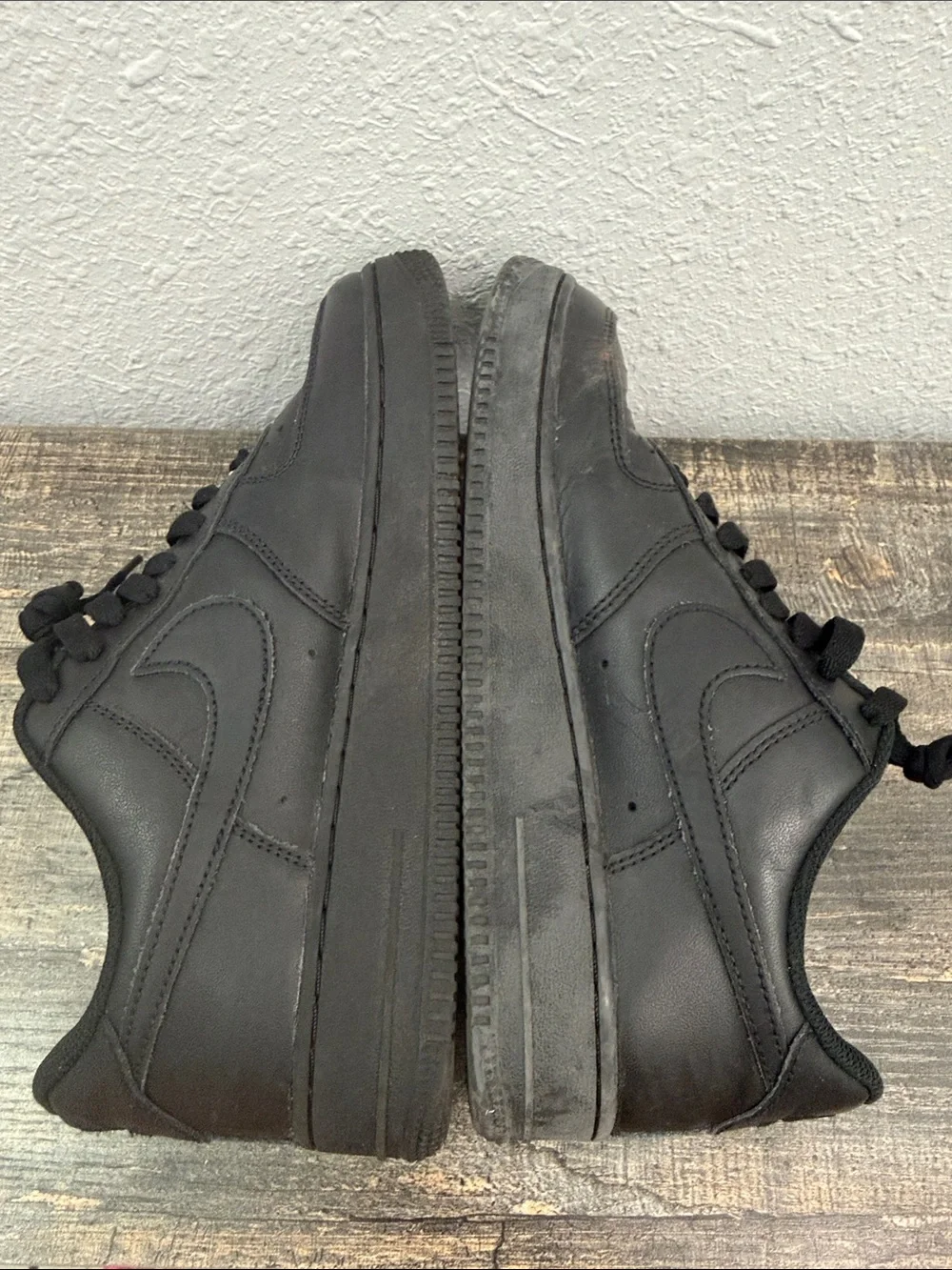Nike Men's All-Black Leather Low-Top Sneakers